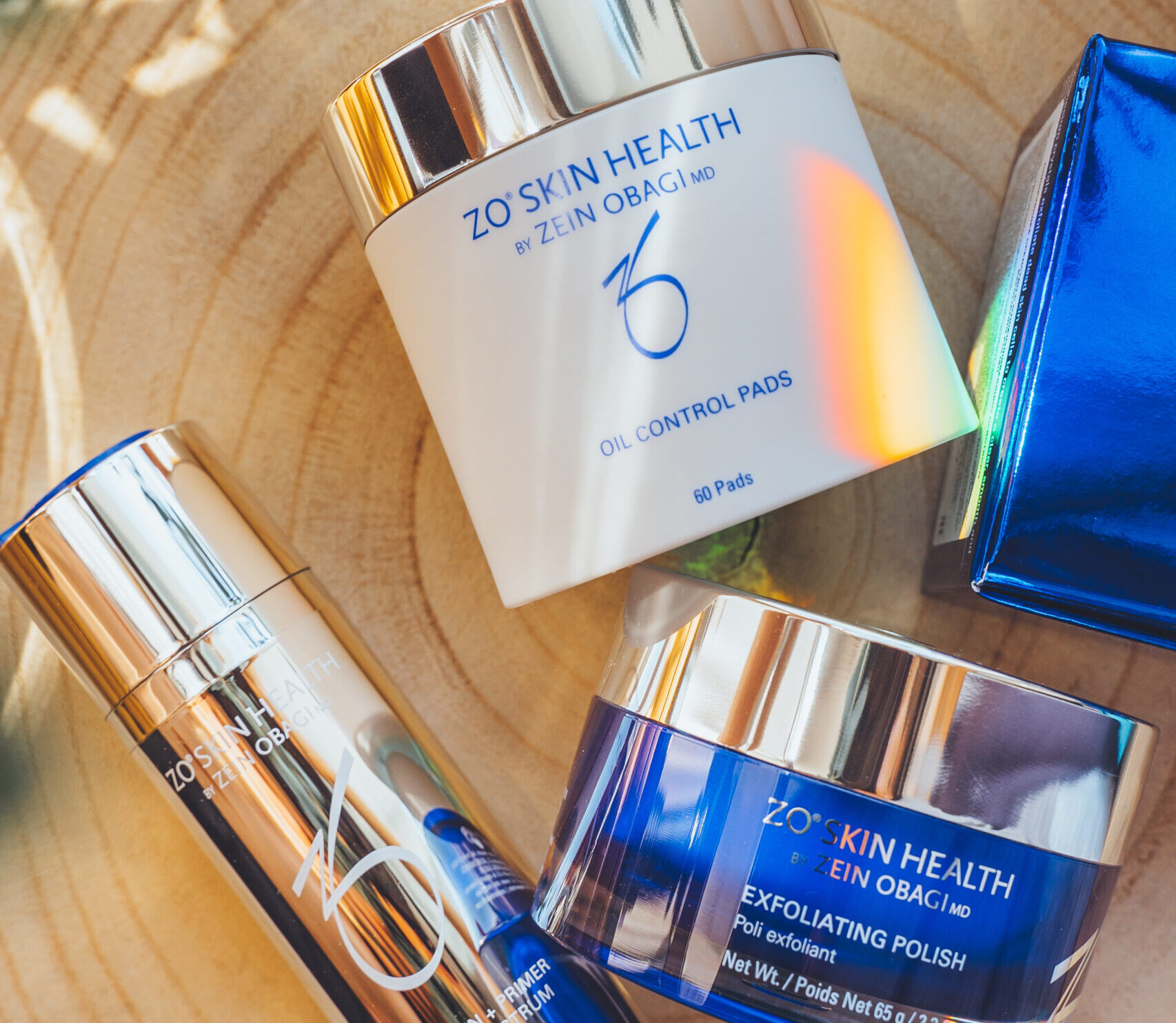 Zein Obagi Zo Skin Health luxury cosmetic products for skincare, acne treatment - sunscreen spf, renewal pads, hydrating cleanser, preventing age toner, oil serum. Flat lay top view.
